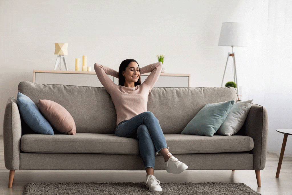 young girl sitting on couch | air conditioning repair allen tx addison tx carrollton tx 
