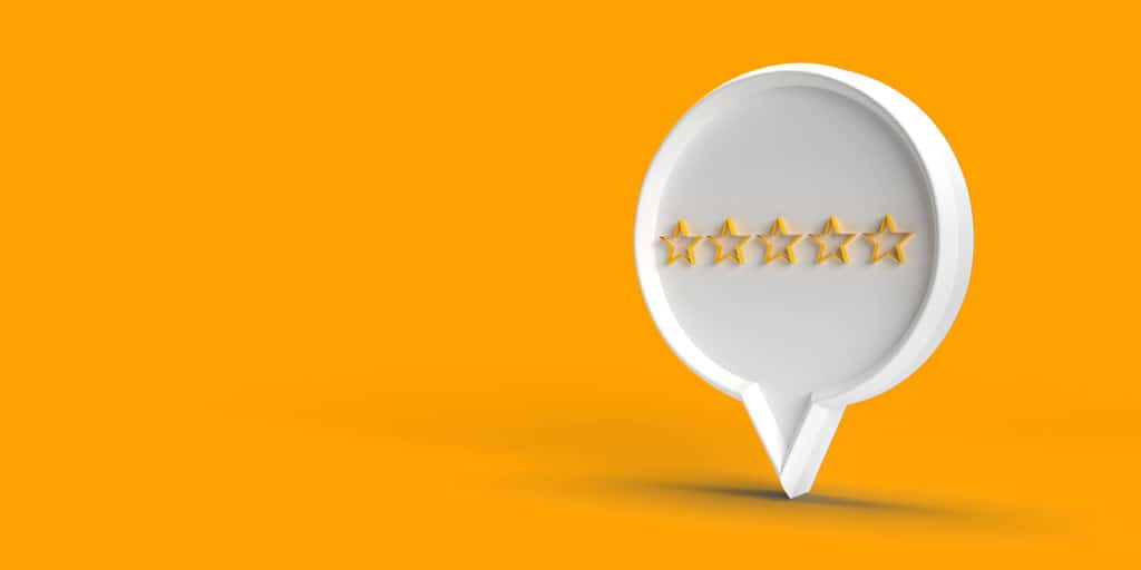 comment bubble with 5 stars inside on an orange background