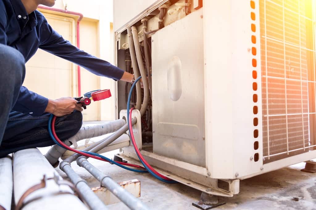Air Conditioning repair Technician performing AC repair in Dallas, Plano, and Frisco, TX