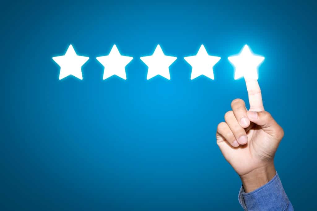 Blue background with 5 lit stars with a man's finger on the 5th star | Humidifier services in Dallas, Plano, and Frisco, TX