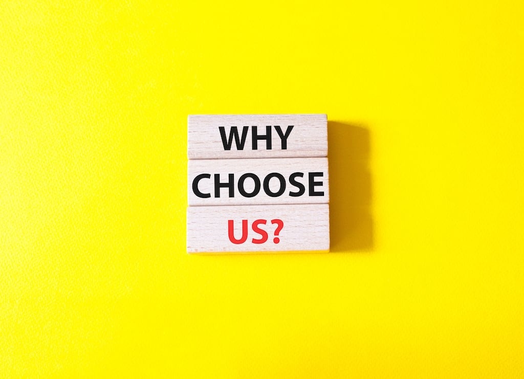 Why Choose Us written on wooden blocks on a yellow background | One Hour Air and Heating Repair Services in Dallas, TX