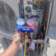 man holding hvac gauges | air conditioner installation addison tx allen tx carrollton tx