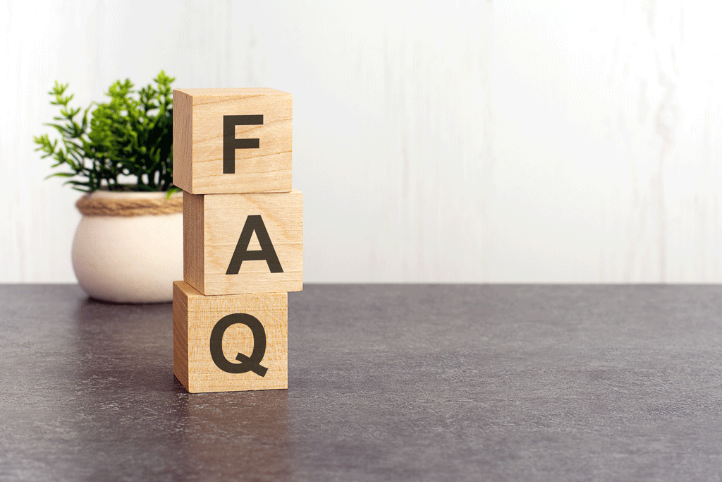 faq on wooden blocks with plant in the background air conditioning service addison tx allen tx 