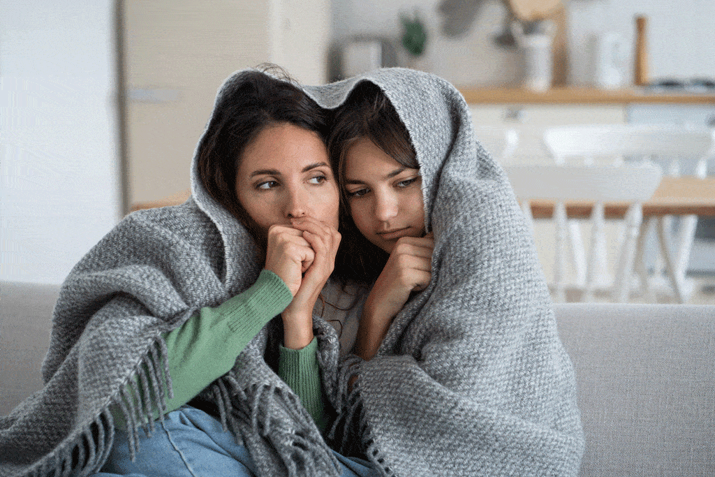 ladies sitting on the couch with blankets heating and ac repair allen tx addison tx