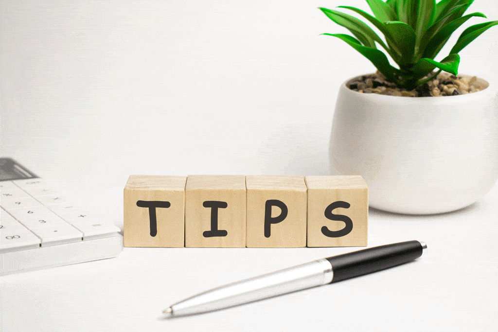 the word tips on wooden blocks with plant and pen in background AC unit frozen pipe outside carrollton tx allen tx 