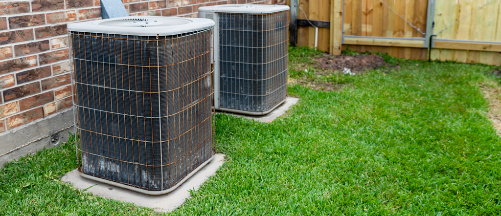 2 older outdoor AC units that need AC Air Conditioner Repair in Dallas, TX