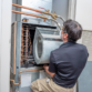 One Hour Air Conditioning & heating of Dallas technician Installing HVAC Motor Types in Dallas, TX