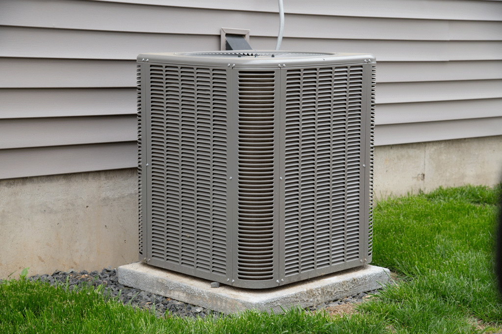 ac unit outside of the house with green grass all around it heating and ac reapir dallas tx richardson tx allen tx 