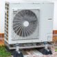 A white air conditioning unit with a drain pan underneath. A Air Conditioning with One Hour Air Conditioning & Heating of Dallas: Your AC Drain Pan Installation Experts