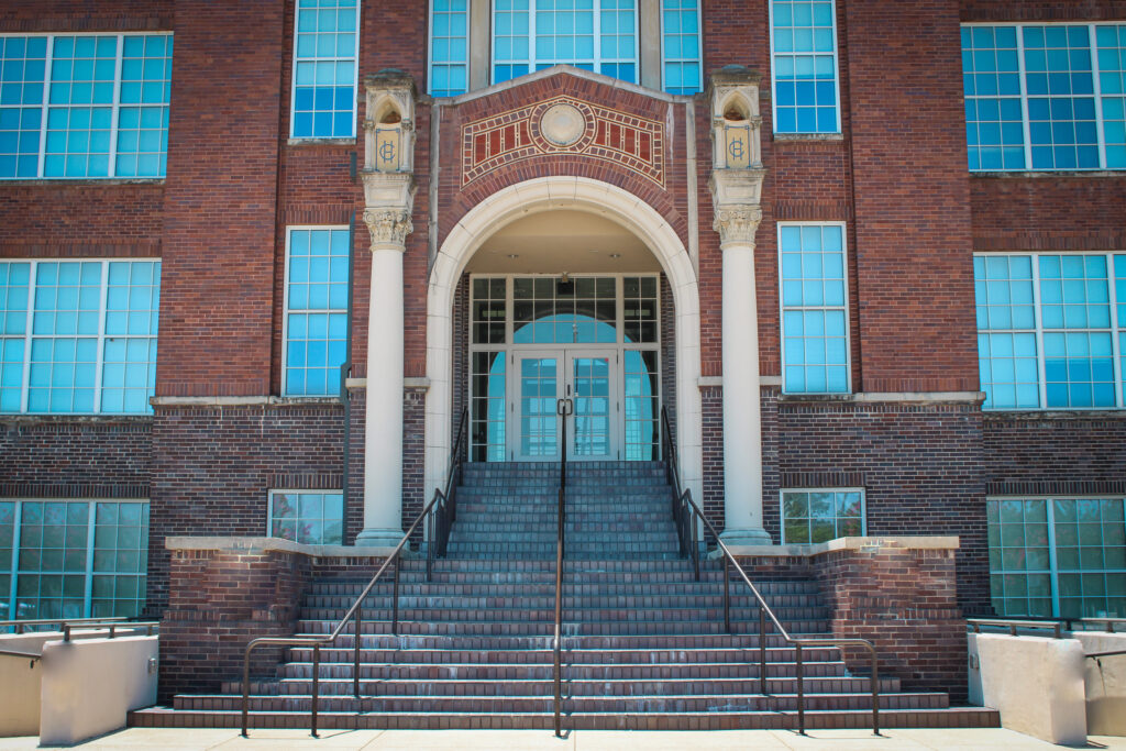The grand entrance to an Art Deco high school building in Cleburne, Texas