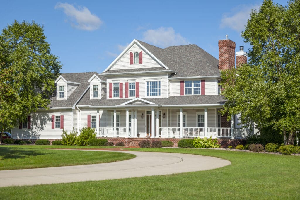 the image of a beautiful mansion home in Dalworthington Gardens complete with a circular driveway.