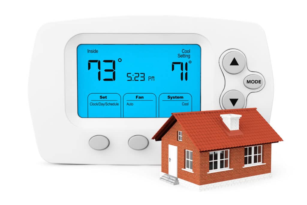 a modern programmable thermostat with a small home against a white background. Programmable Thermostats with One Hour Air Conditioning & Heating of Dallas, TX
