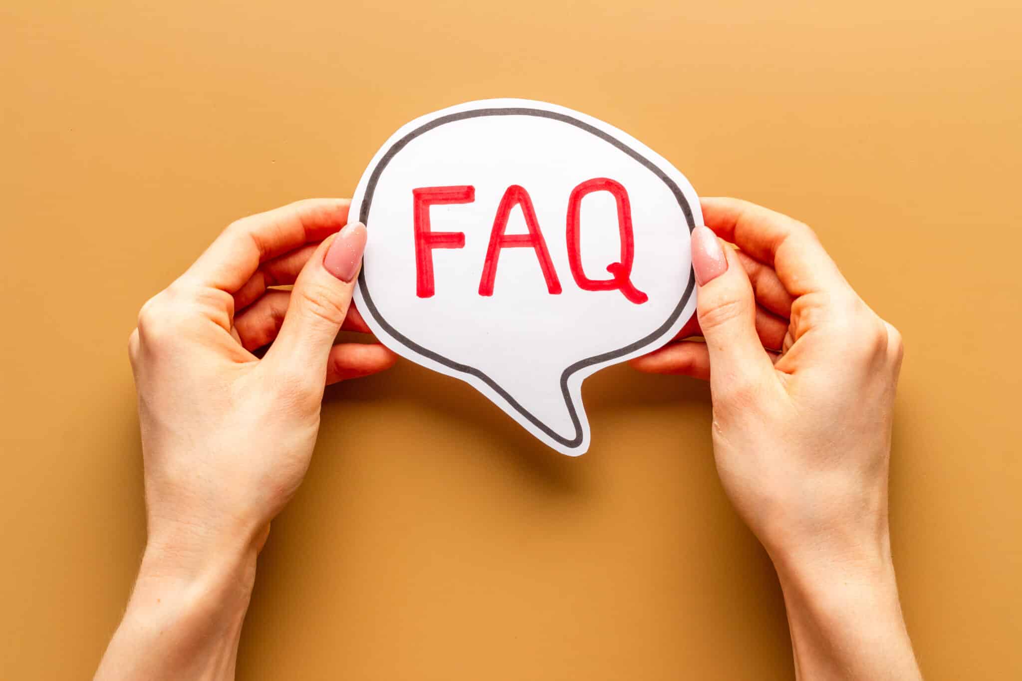 Insulation Materials Hands with FAQ word on paper bubble. Frequently asked questions concept, Insulation Materials.
