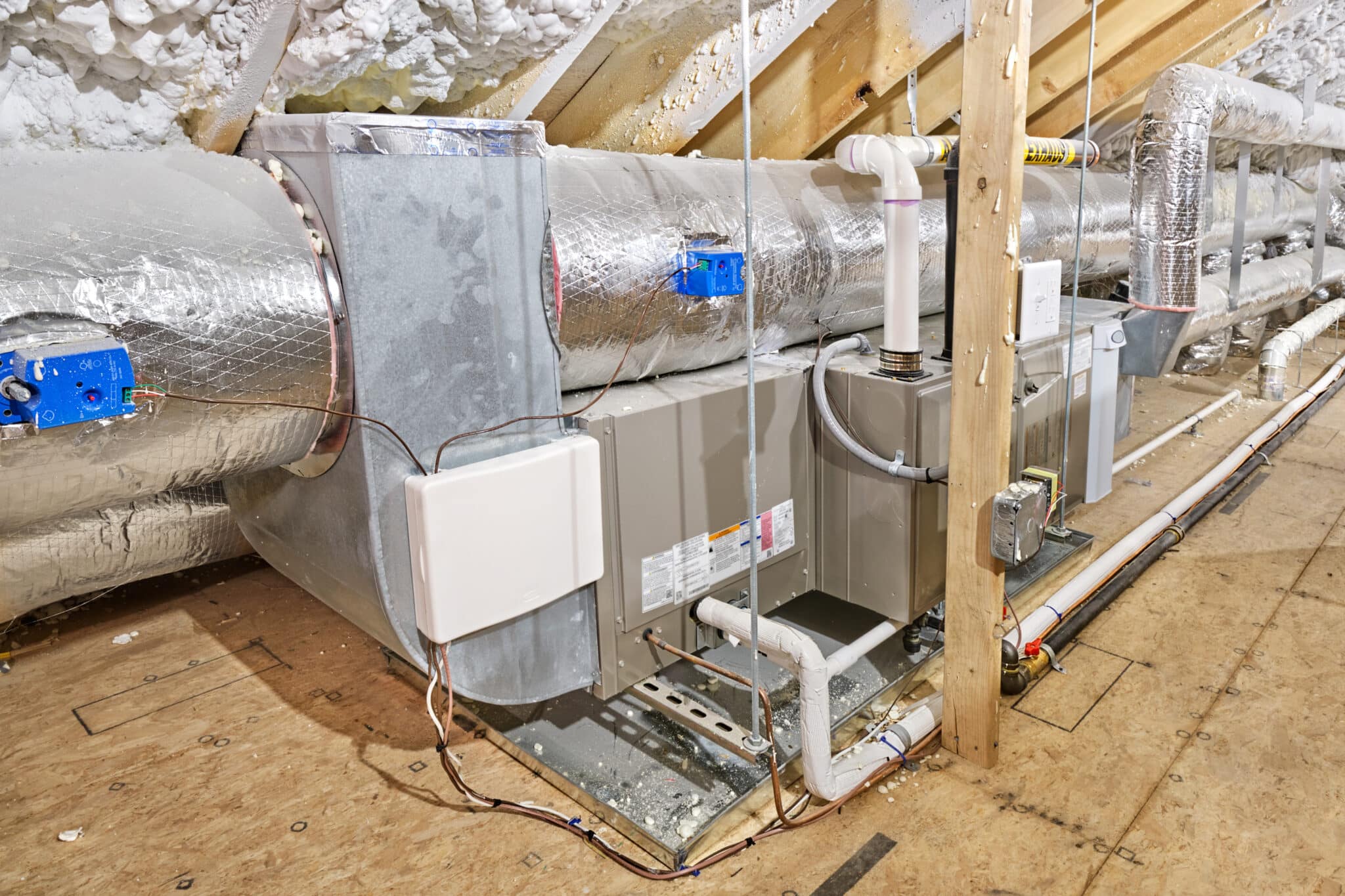 Attic gas furnace, pipes and ductwork. Heat Loss.