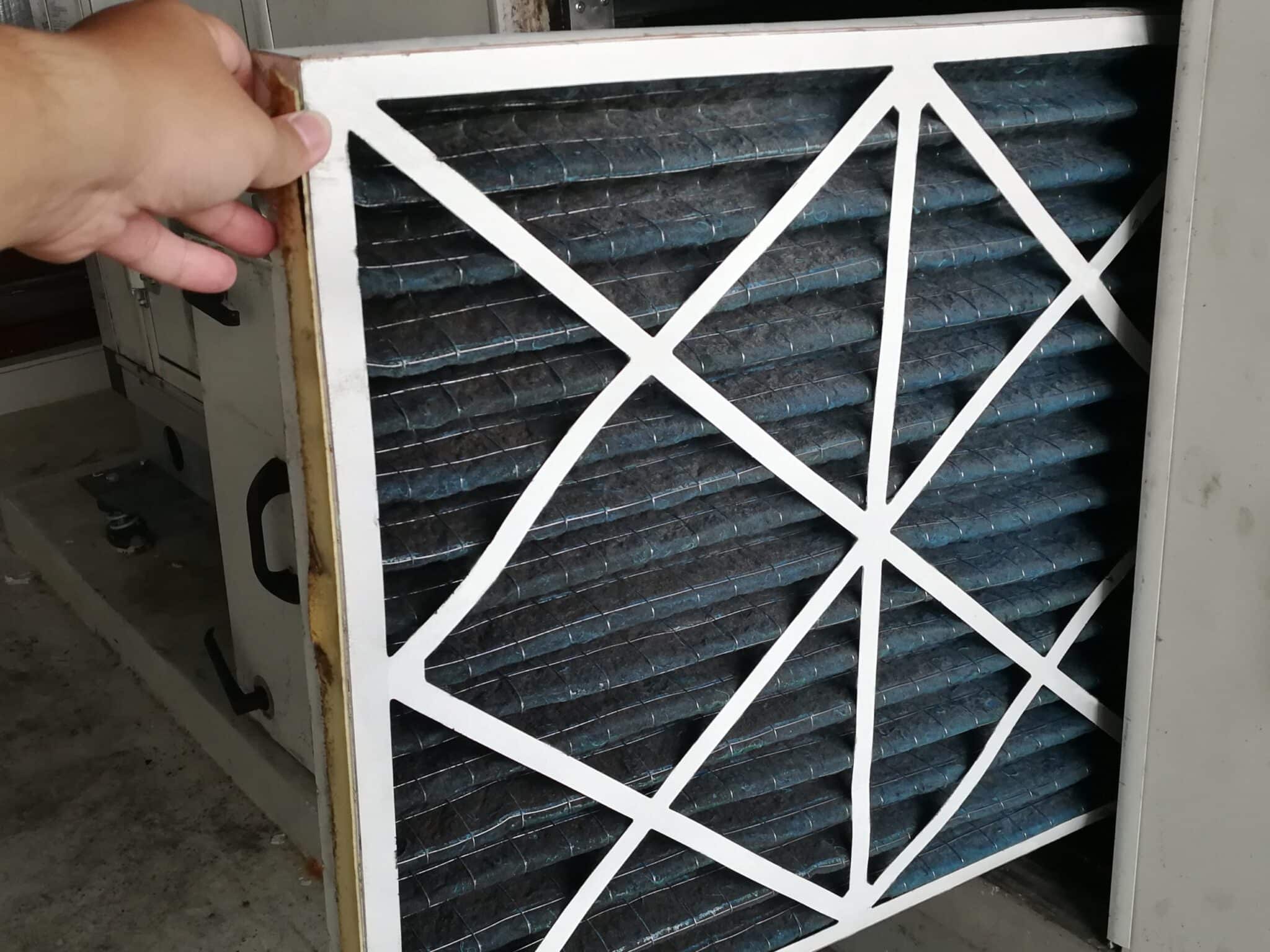 Replacement a new filter - HVAC maintenance.