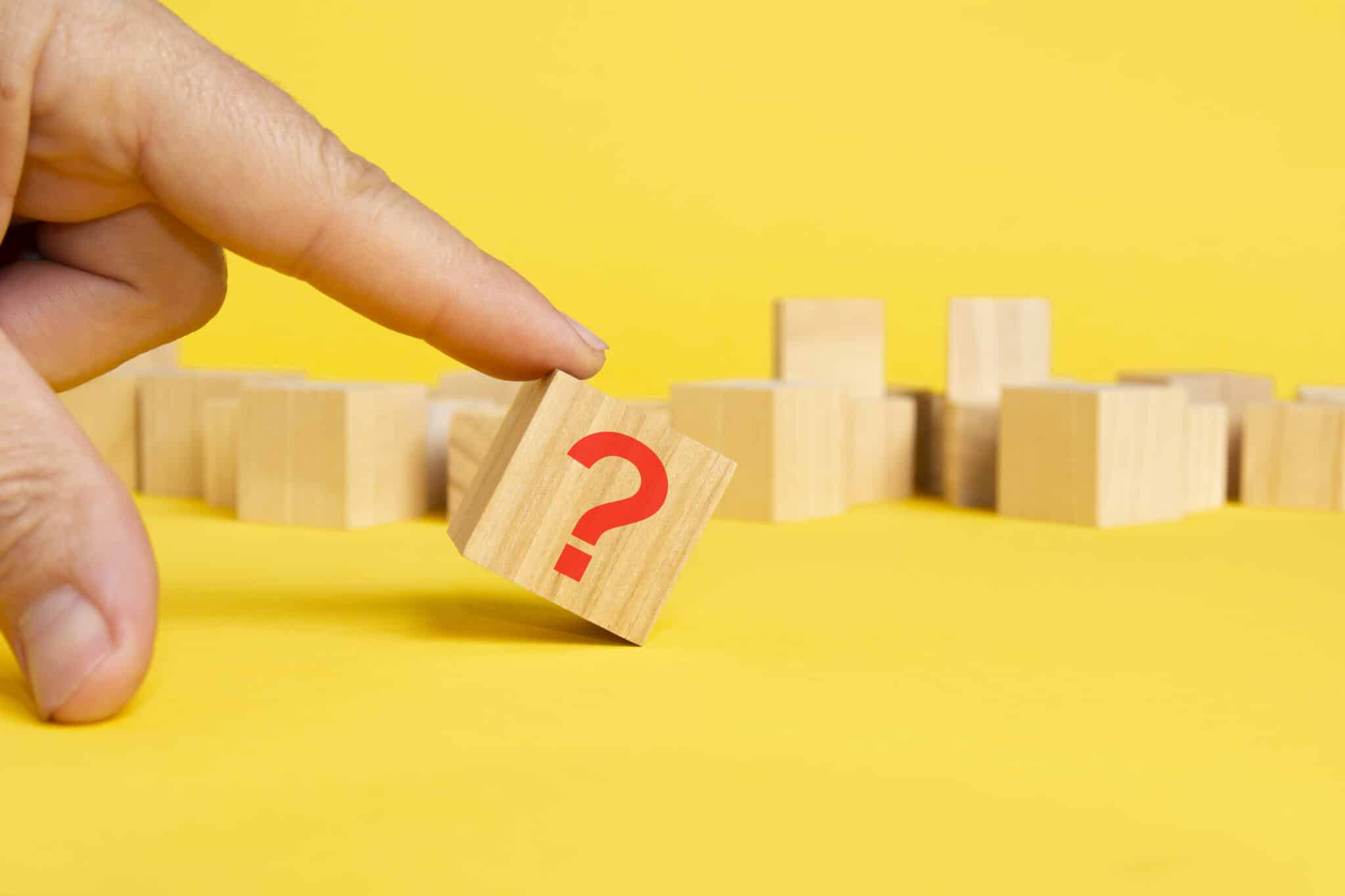 Wooden block with question mark on yellow background, HVAC Filtration Techniques.